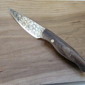 Handmade kitchen knife from recycled saw blade, patterned steel blade.